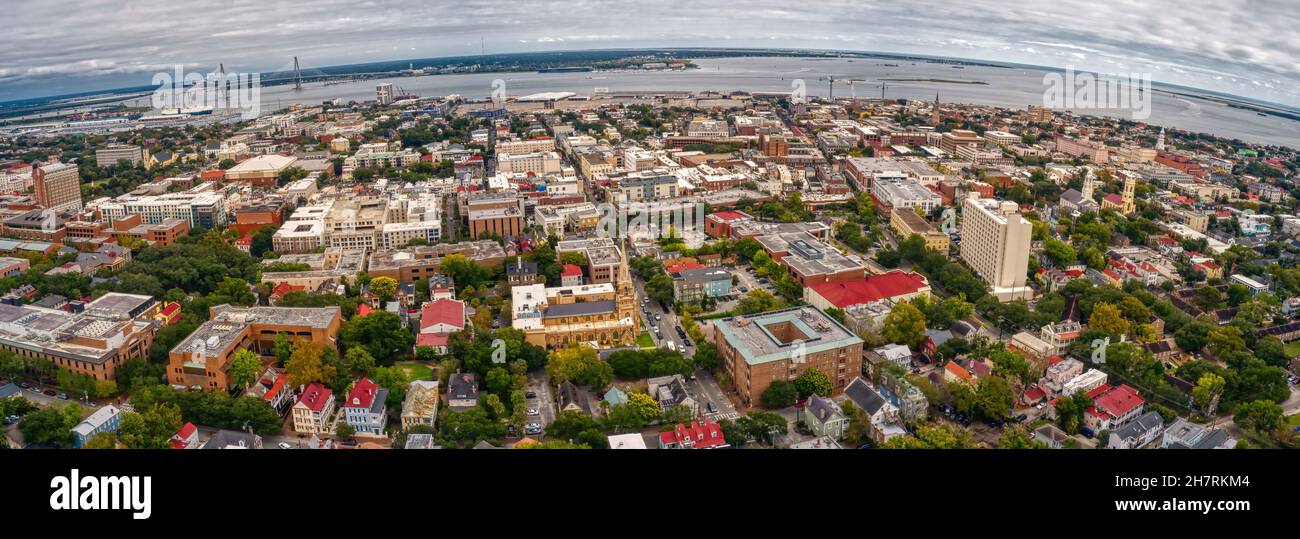 Panoramic aerial view of Charleston with dense buildings under a cloudy