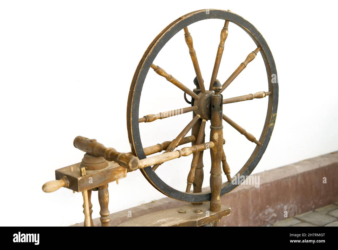 antique spinning wheel in an openair museum Stock Photo Alamy