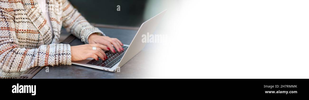 Woman hands with red manicure typing on laptop keyboard. Communication, workplace, business, education, freelance, internet, leisure time and technolo Stock Photo