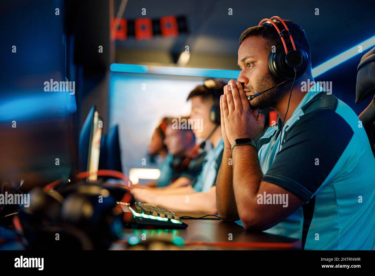 Professional player playing important match in cyber club Stock Photo