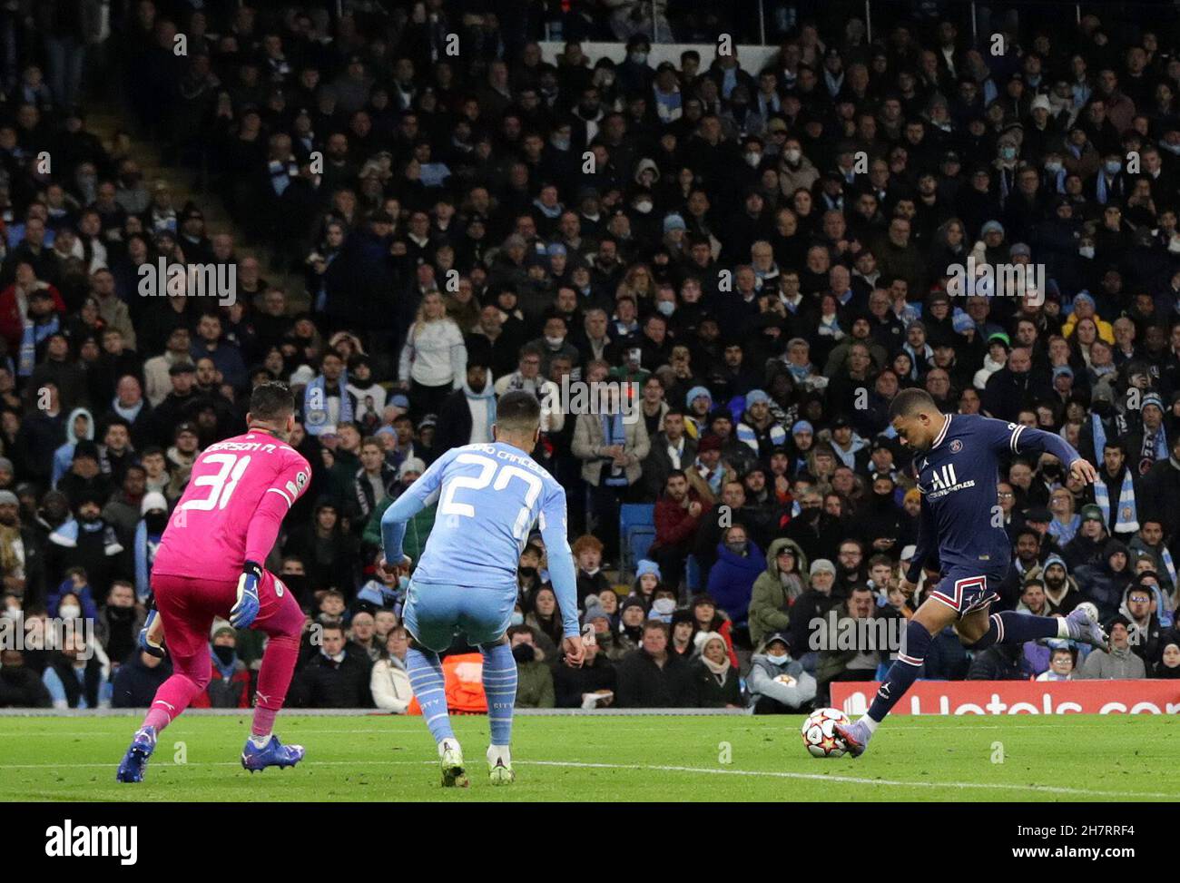 City Stadium, Manchester, UK. 24th Nov, 2021. UEFA Champions League football, Manchester City versus PSG; Kylian Mbappe of Paris Saint Germain shoots and scores past Manchester City goalkeeper Ederson to give his side a 0-1 lead after 48 minutes Credit: Action Plus Sports/Alamy Live News Stock Photo