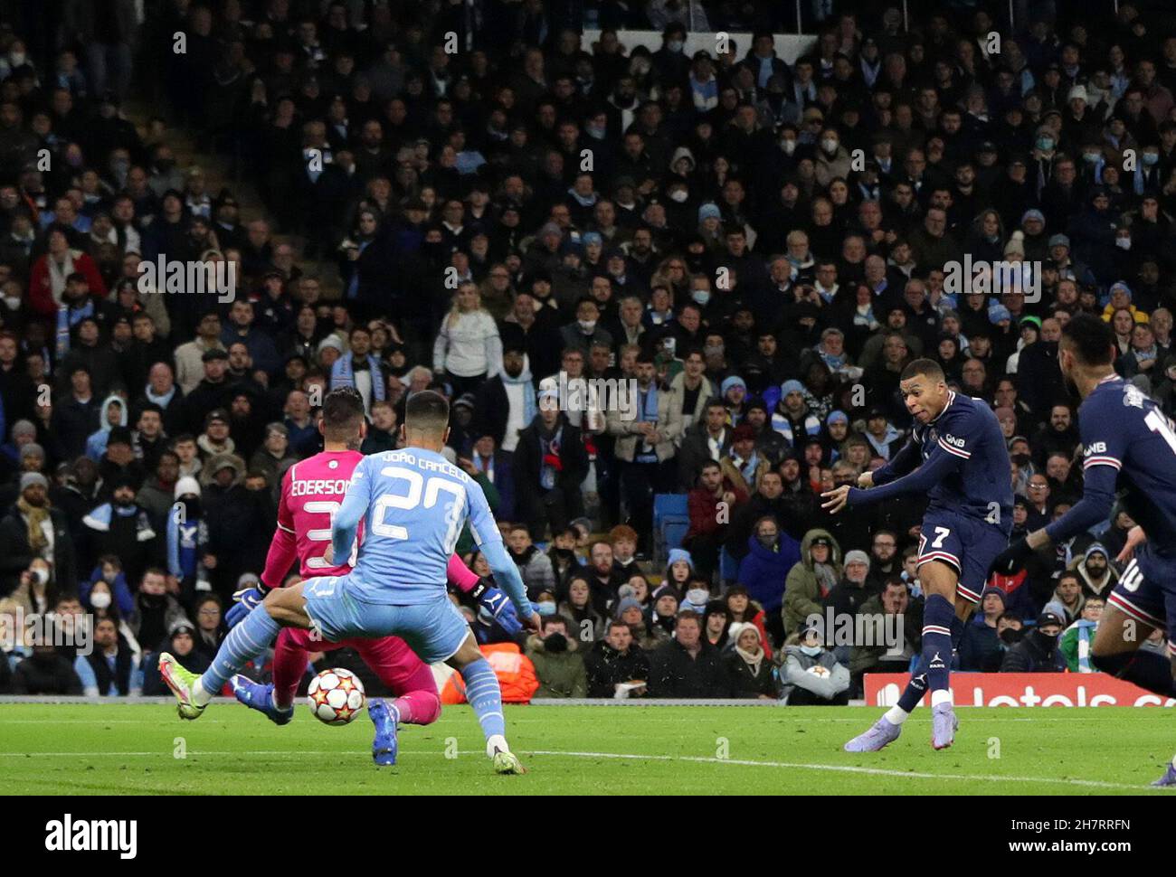 City Stadium, Manchester, UK. 24th Nov, 2021. UEFA Champions League football, Manchester City versus PSG; Kylian Mbappe of Paris Saint Germain shoots and scores past Manchester City goalkeeper Ederson to give his side a 0-1 lead after 48 minutes Credit: Action Plus Sports/Alamy Live News Stock Photo