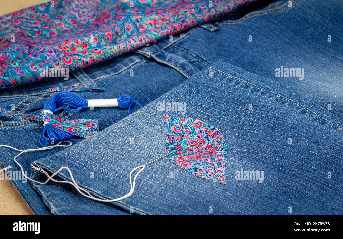 Visible mending on jeans, creative sustainable fashion, repair, mend and  recycle. slow fashion make it last Stock Photo - Alamy