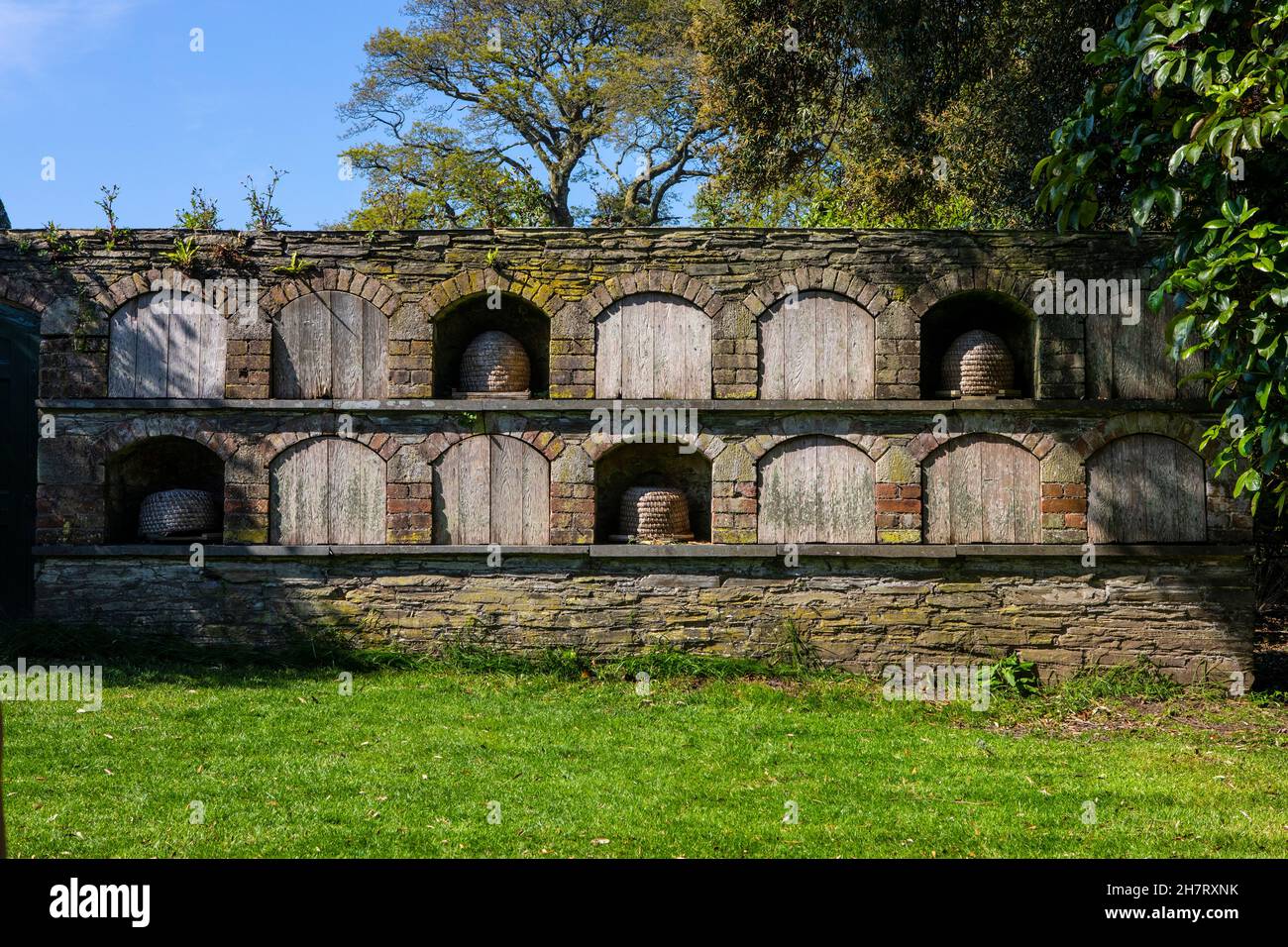 Bee hives at the beautiful Lost Gardens of Heligan in Cornwall, UK. Stock Photo