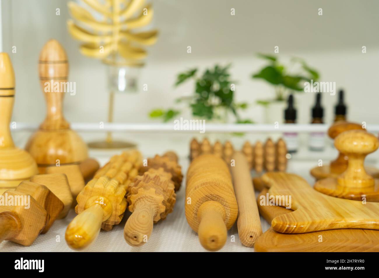 Closeup of wooden massage tools on a white table Stock Photo