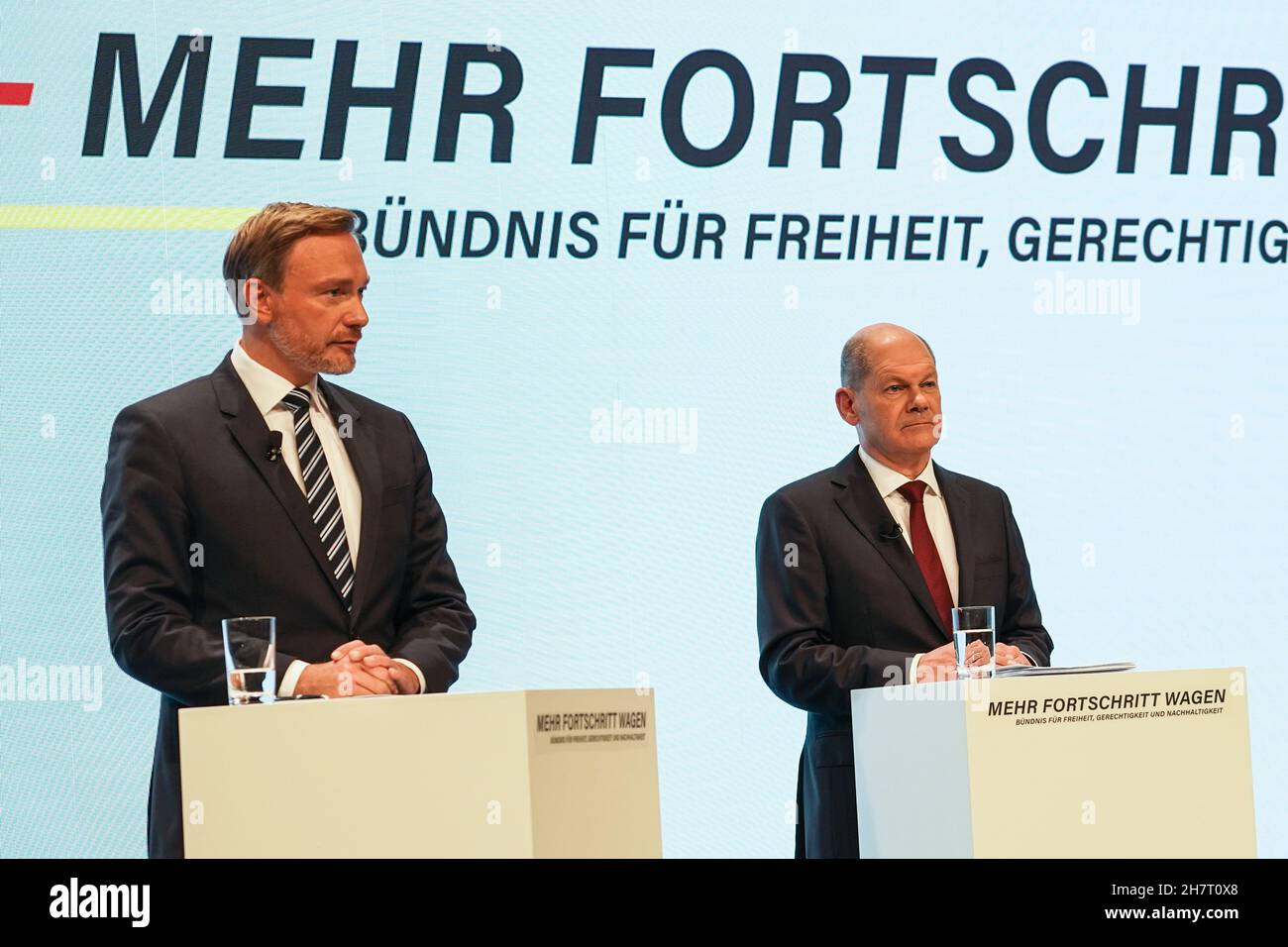 Berlin, Germany. 24th Nov, 2021. Leader of Germany's Free Democratic Party (FDP) Christian Lindner (L) and Olaf Scholz of the Social Democratic Party (SPD) attend a joint press conference in Berlin, Germany, on Nov. 24, 2021. Coalition negotiations among Germany's Social Democratic Party (SPD), the Greens and the Free Democratic Party (FDP) ended as the three parties presented an agreement on Wednesday. Credit: Stefan Zeitz/Xinhua/Alamy Live News Stock Photo
