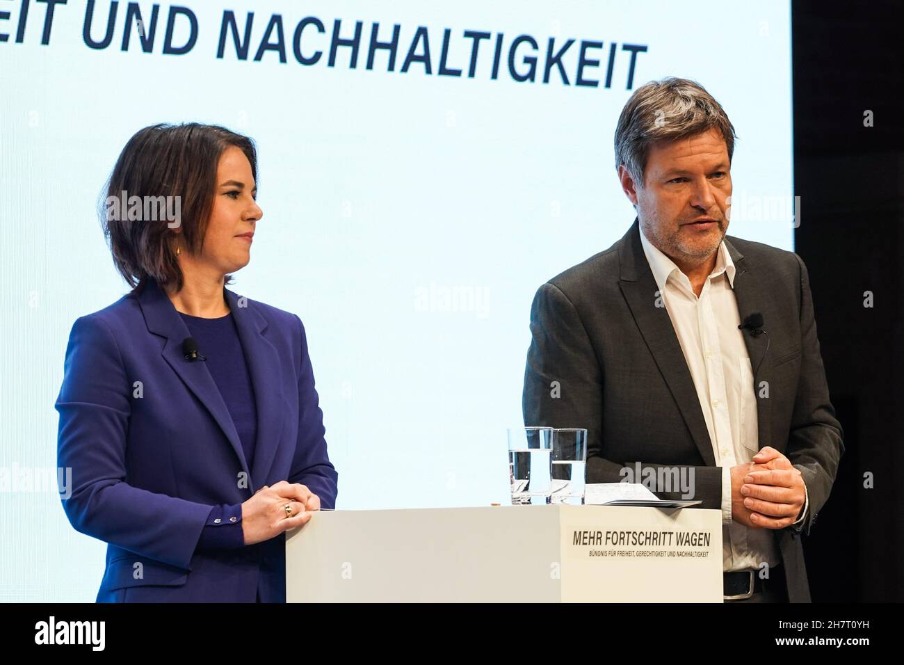 Berlin, Germany. 24th Nov, 2021. Leaders of Germany's The Greens Robert Habeck (R) and Annalena Baerbock attend a joint press conference in Berlin, Germany, on Nov. 24, 2021. Coalition negotiations among Germany's Social Democratic Party (SPD), the Greens and the Free Democratic Party (FDP) ended as the three parties presented an agreement on Wednesday. Credit: Stefan Zeitz/Xinhua/Alamy Live News Stock Photo