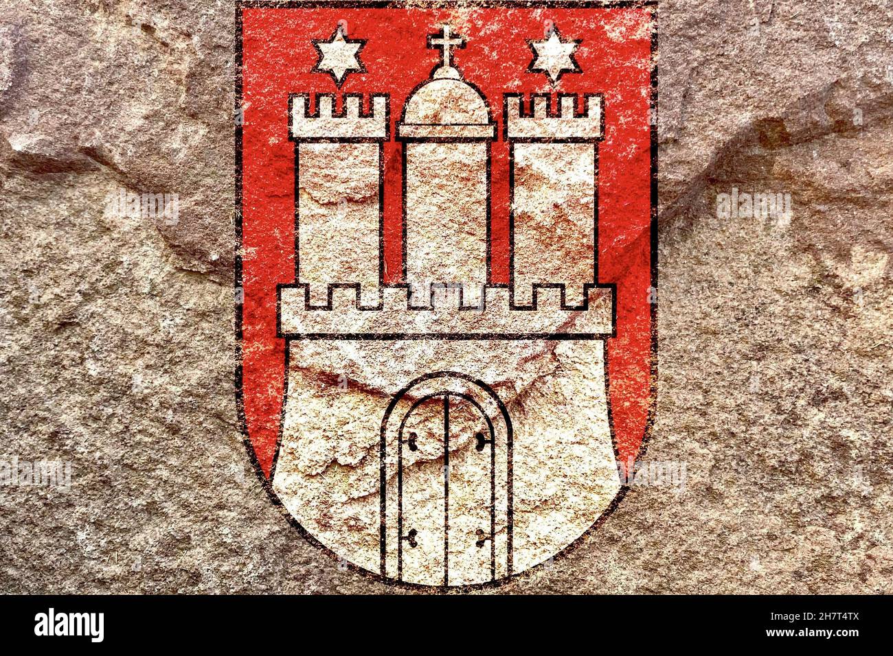 Lesser coat of arms of Hamburg isolated on weathered solid rock wall background Stock Photo