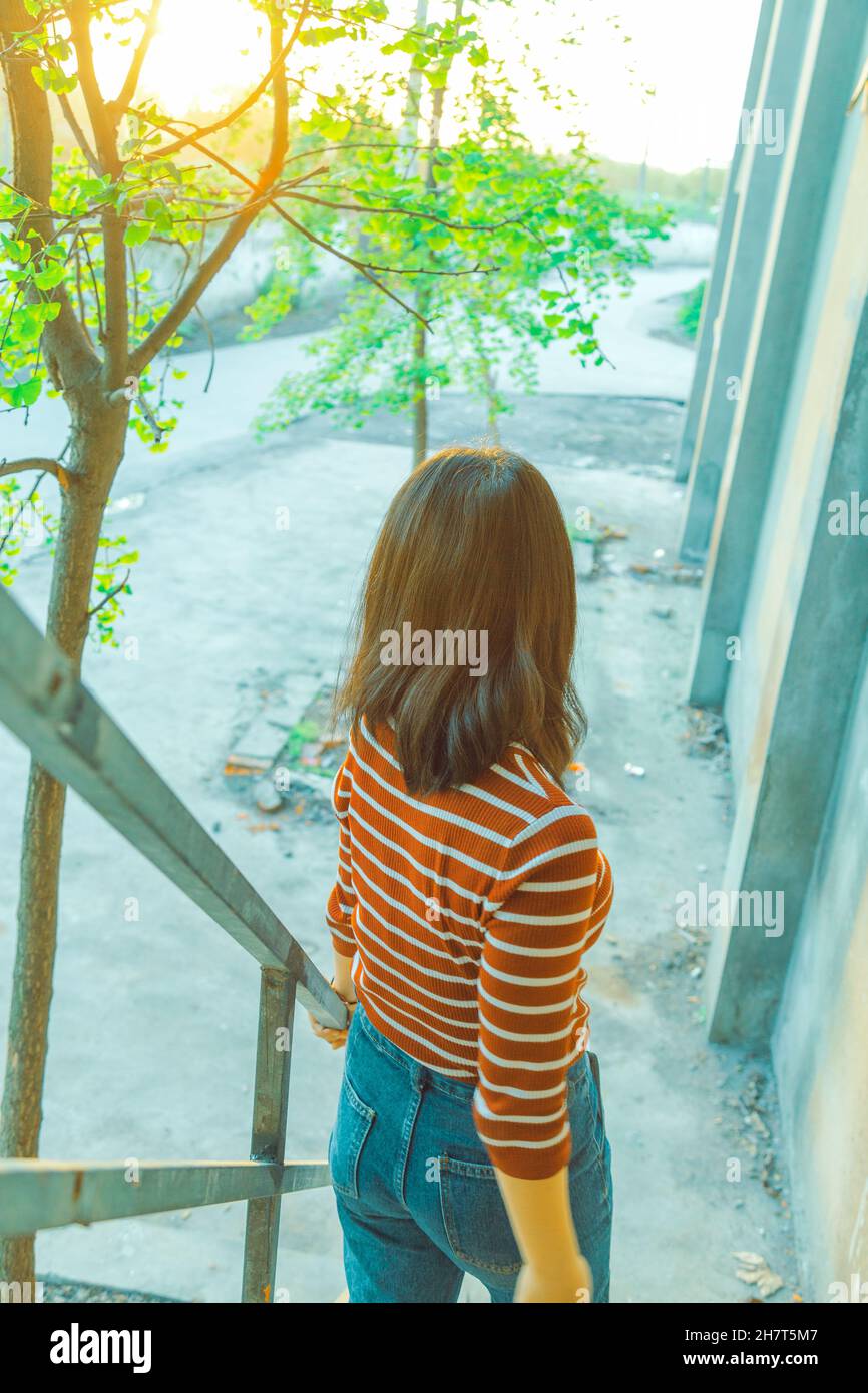 The early spring season. The back of the girl as she descends the ...