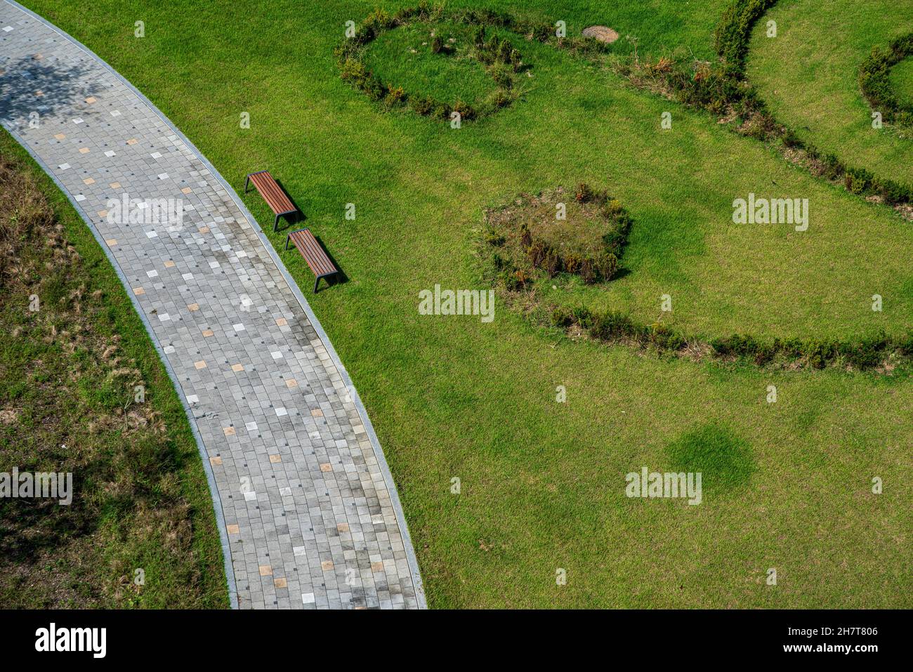 Aerial view of a park with a pathway and benches Stock Photo - Alamy