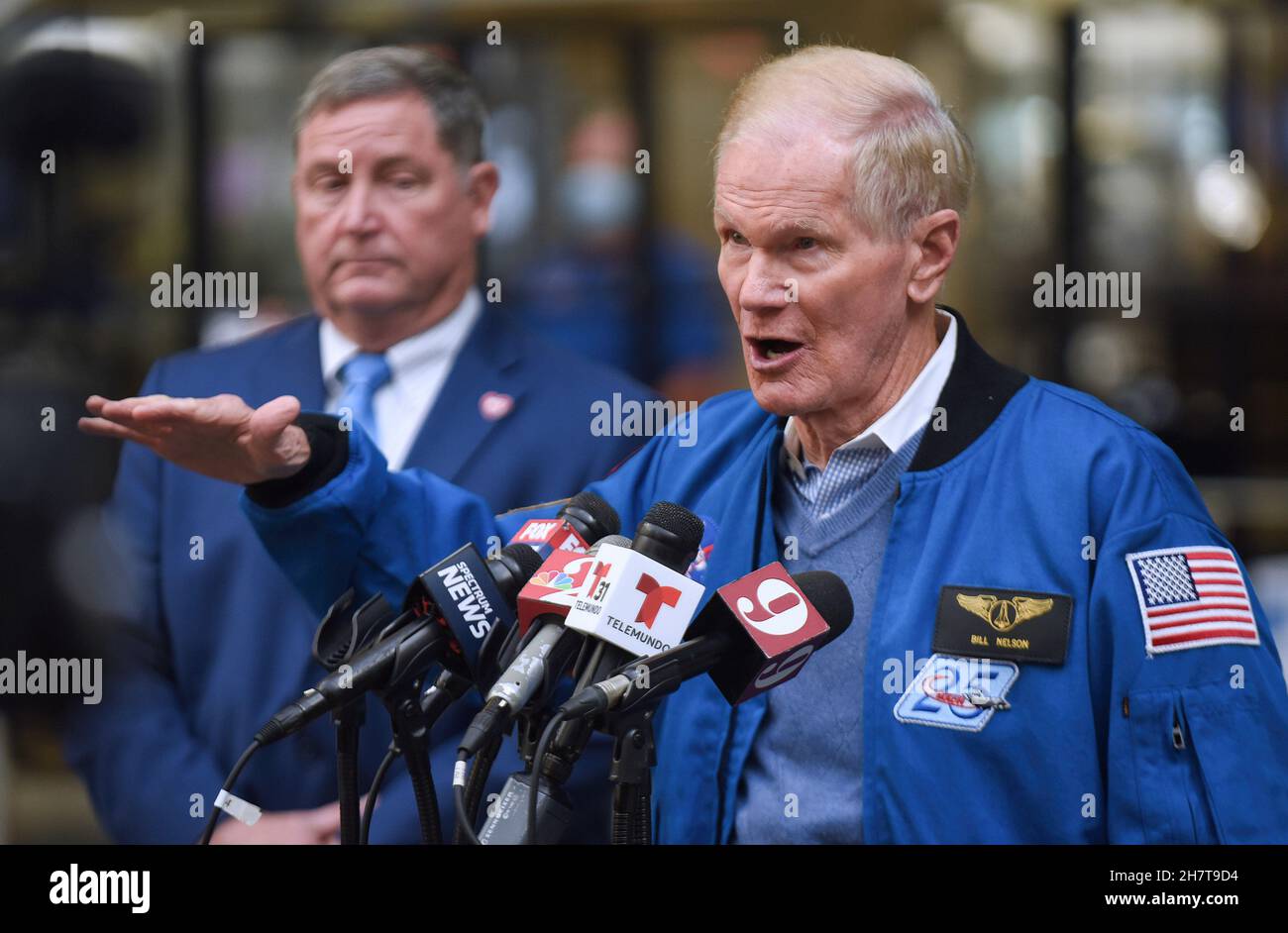 NASA Administrator Bill Nelson (R) delivers his speech while Orlando Aviation Authority CEO Phil Brown (L) attentively listens during a press conference of the implementation of a NASA-developed flight scheduling technology to all airports across the country in 2023.The Airspace Technology Demonstration 2 (ATD-2) system was transferred to the Federal Aviation Administration (FAA) in September. This technology will allow planes to roll directly to the runway for takeoff to avoid excessive taxi-out time and hold time thereby reducing fuel use, emissions, and passenger delays. Stock Photo