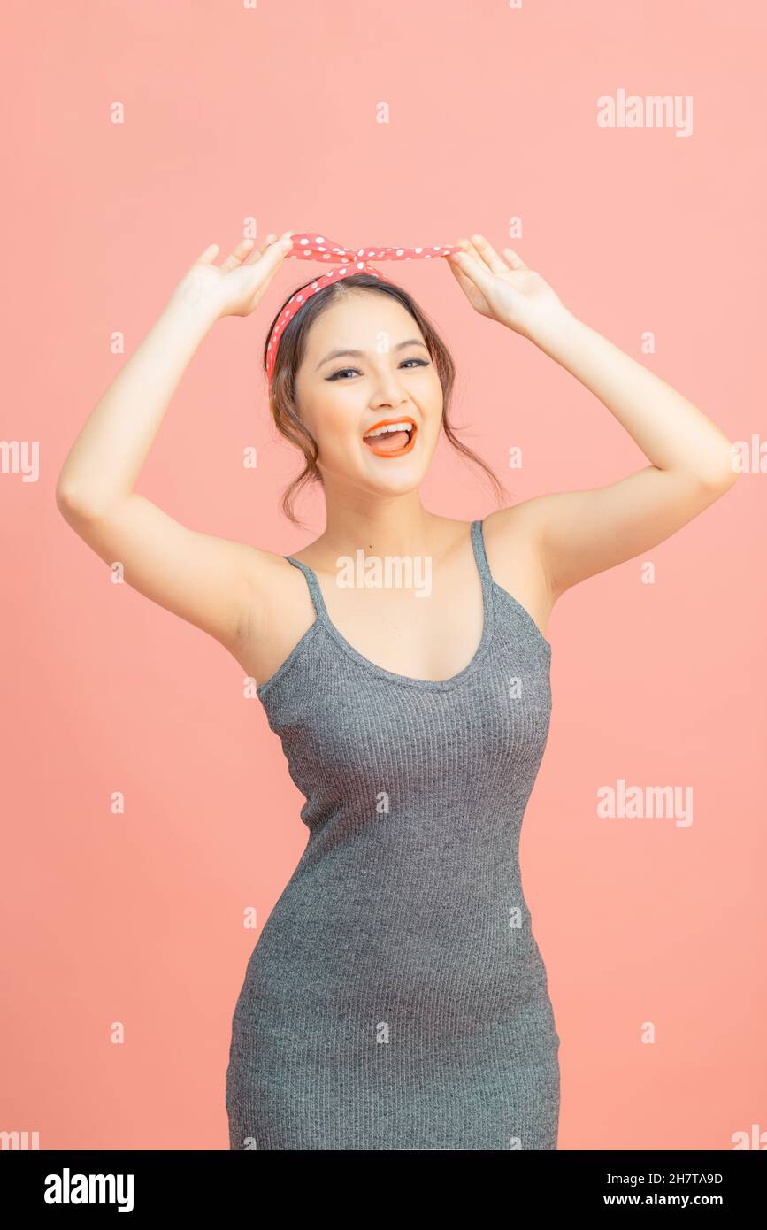 Portrait of lucky cute pretty woman enjoy summer free time holiday wear casual style clothes isolated over pink color background Stock Photo