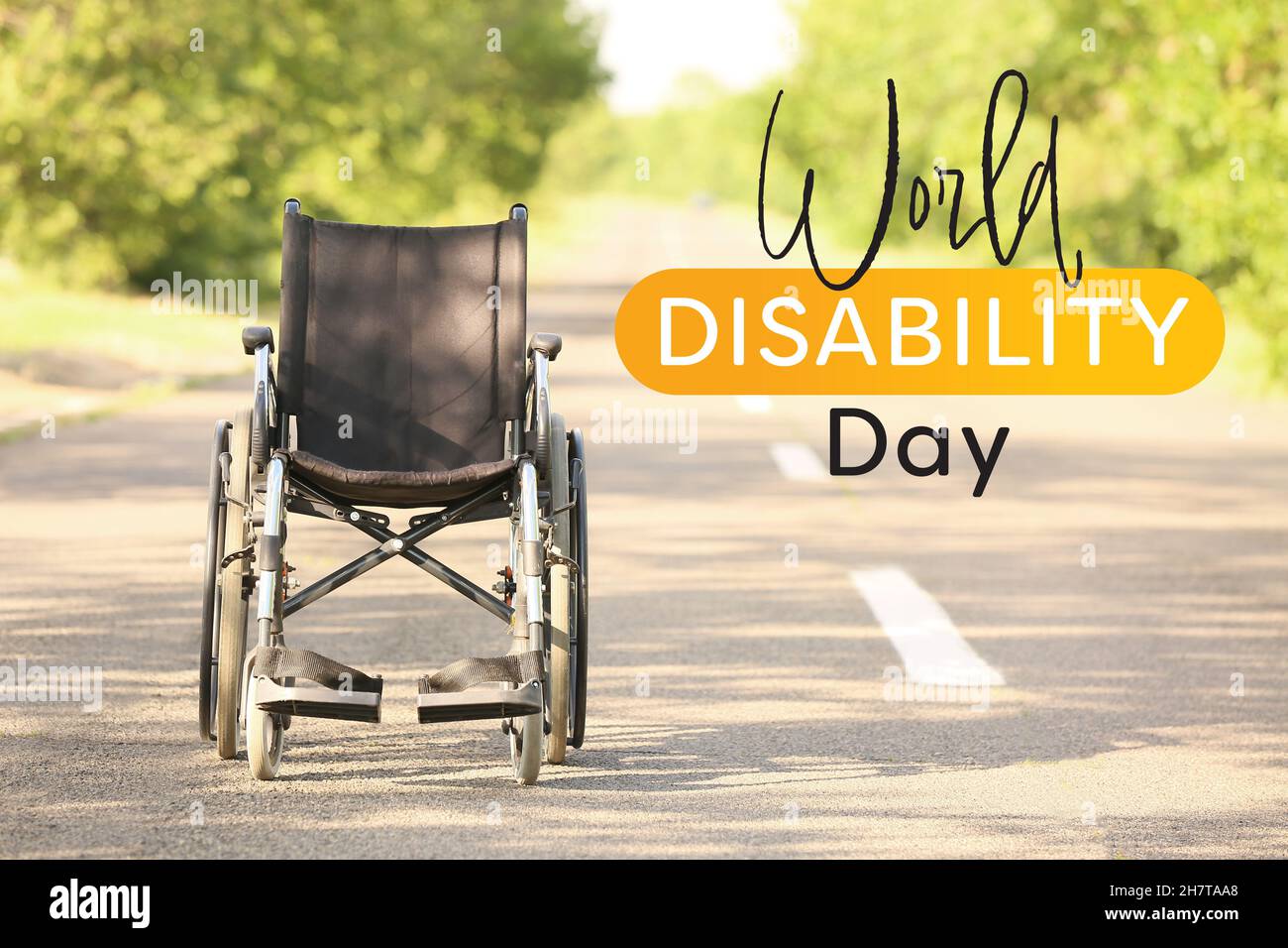 Empty wheelchair on road outdoors. International Day of Persons with Disabilities Stock Photo