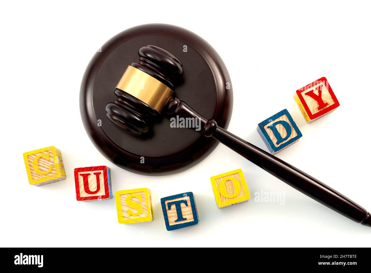 Legal decision regarding the custody of children after a divorce concept theme with close up on a wooden gavel and kids wood blocks toy with letters i Stock Photo