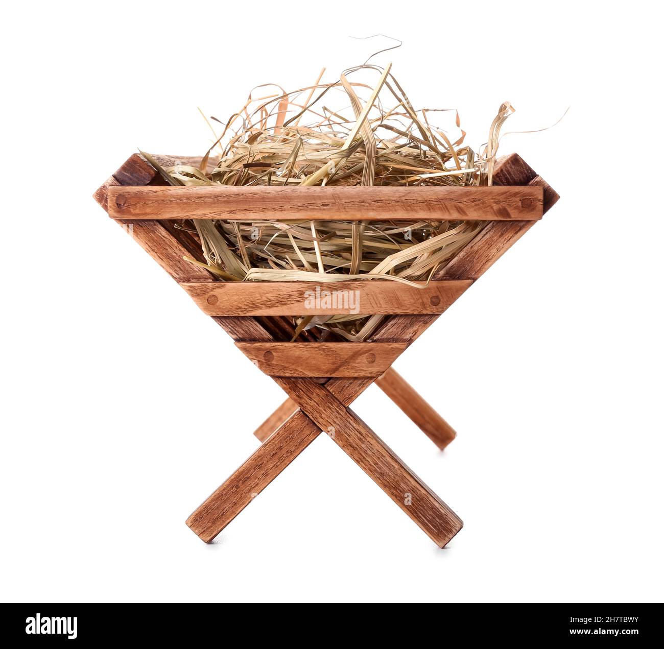 Wooden manger with hay on white background Stock Photo - Alamy