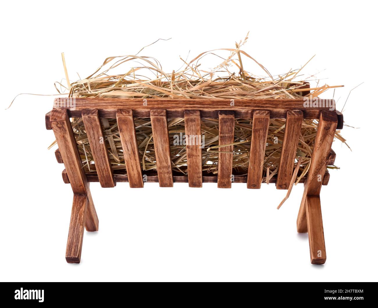 Wooden manger with hay on white background Stock Photo - Alamy