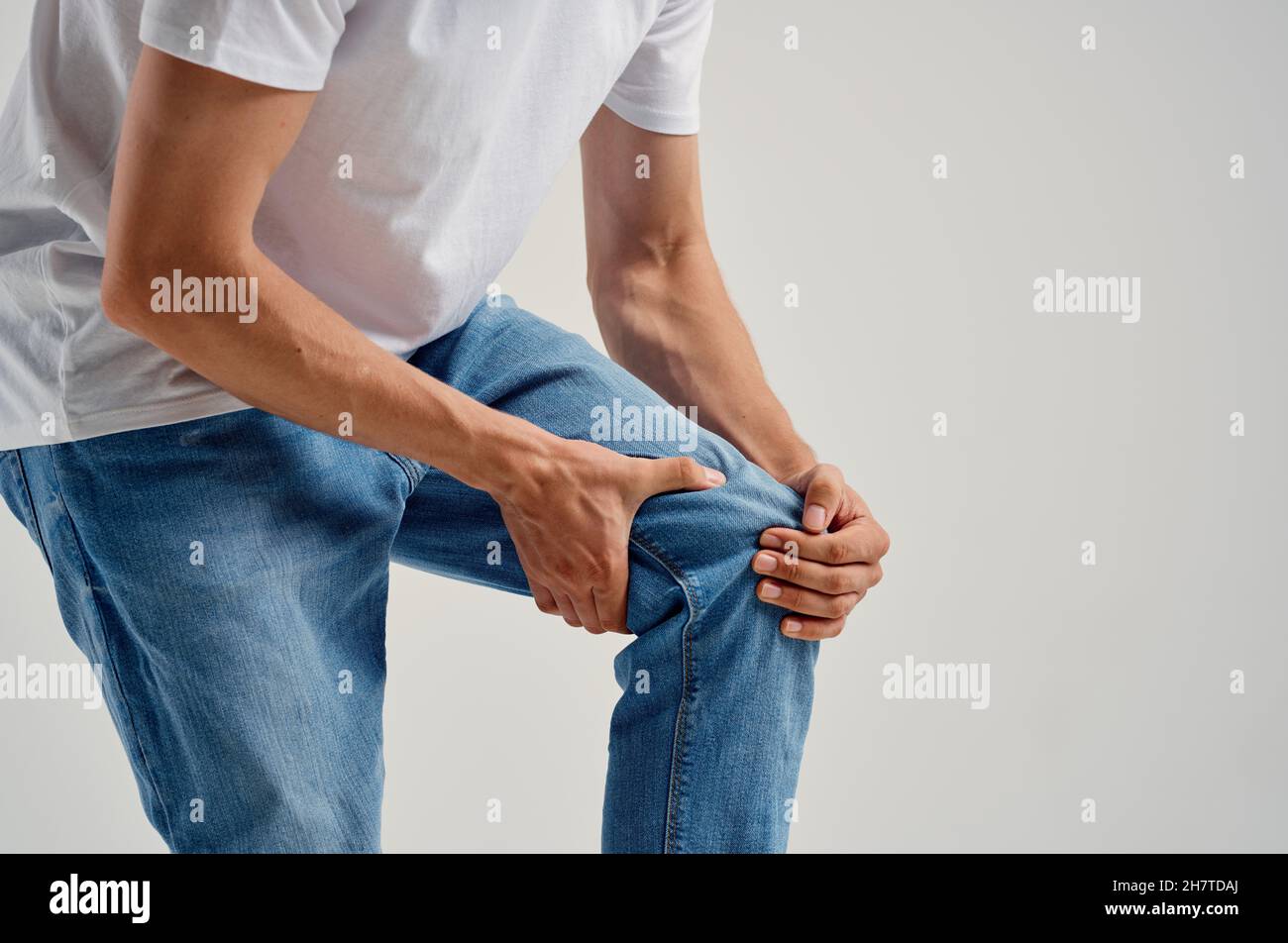 Man sitting on chair knee pain health problems Stock Photo Alamy