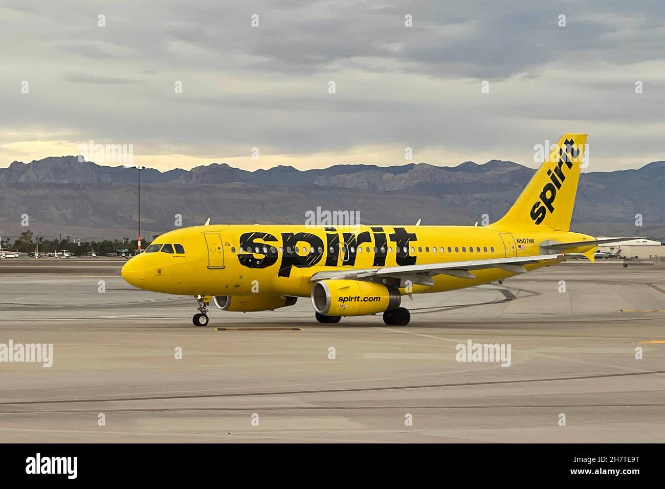A Spirit Airlines 2005 Airbus A319-132 fixed wing twin multi engine airplane (Registration N507NK) taxis on the runway at McCarran International Airpo Stock Photo