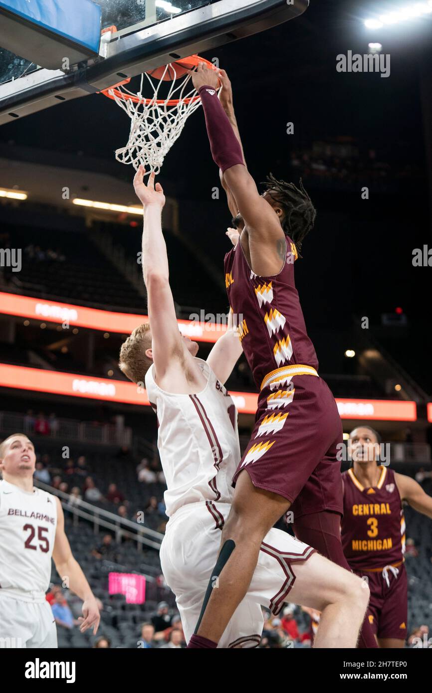 Central Michigan Chippewas forward Ralph Bissainthe (1) scores over Bellarmine Knights forward Sam Devault (14) during a NCAA basketball game, Tuesday Stock Photo