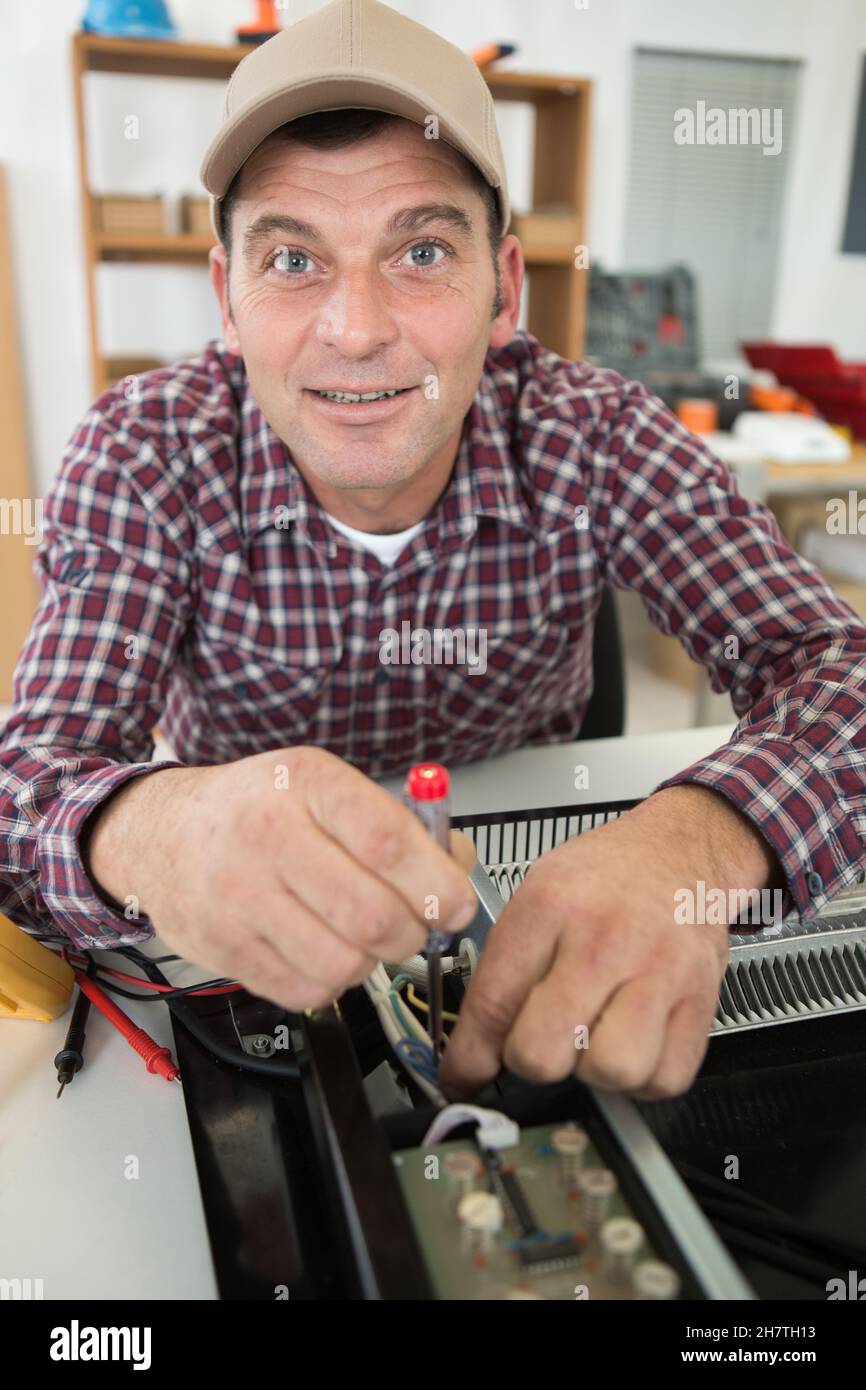 Broken heater repairman hires stock photography and images Alamy
