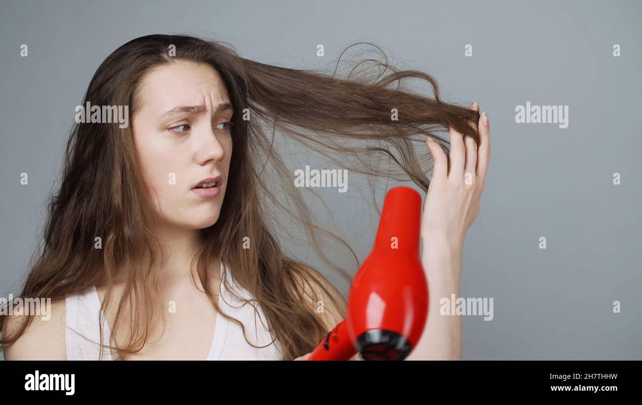 Woman unhappy hair hi-res stock photography and images - Alamy