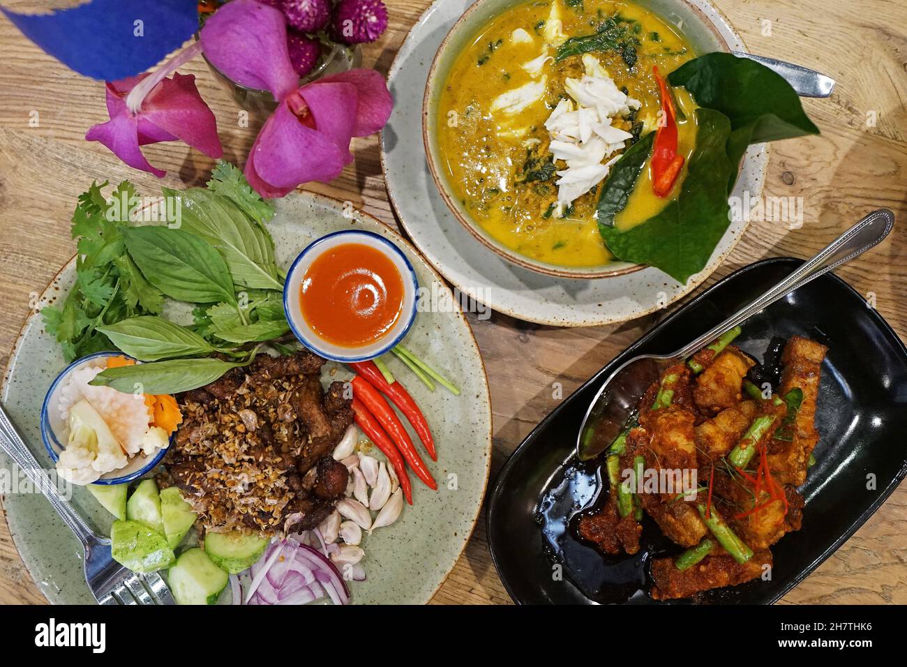 Crispy pork belly in peanut and coconut chili paste served with deep