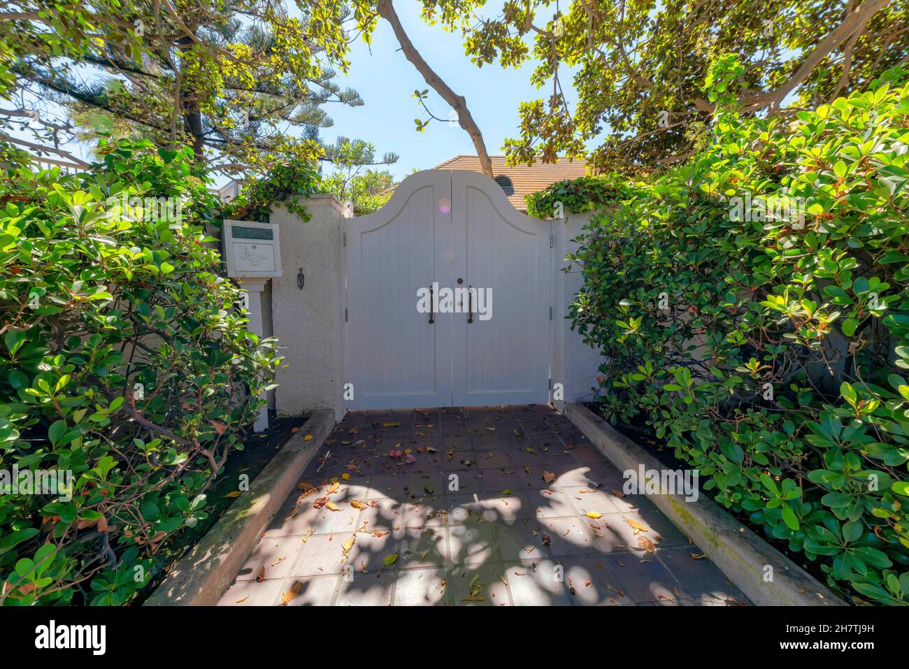 White wood double gate entrance of a house at La Jolla, California ...