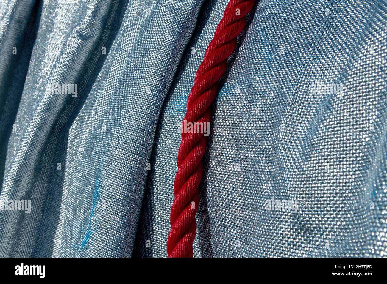 Paris, France-September 2021; Close up view of red ropes and polypropylene fabric of the wrapped Arc de Triomphe art installation by Christo Stock Photo
