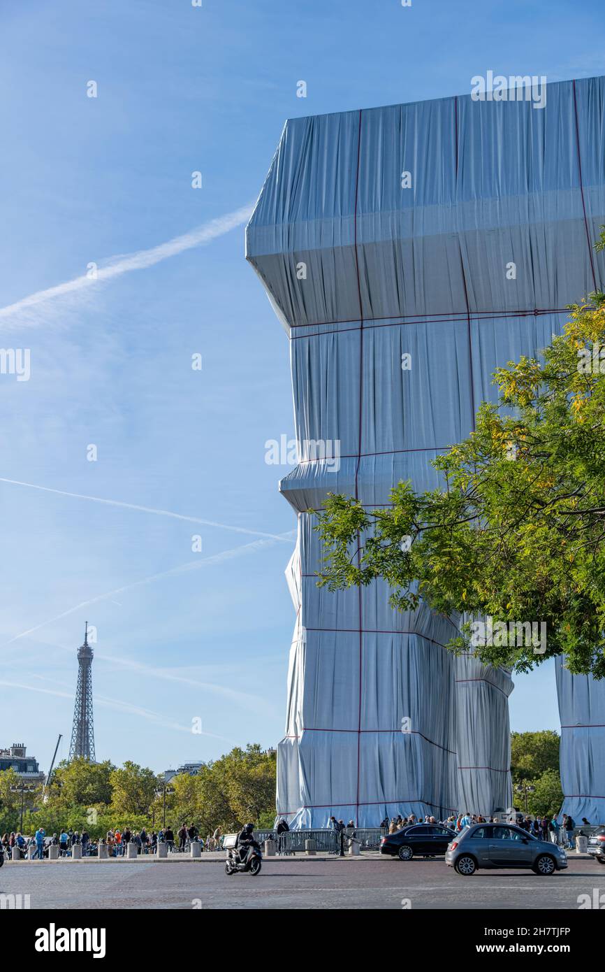 Paris, France-September 2021; Partial vertical view of wrapped Arc de Triomphe art installation by Christo on Place Charles de Gaulle, with Eiffel Tow Stock Photo