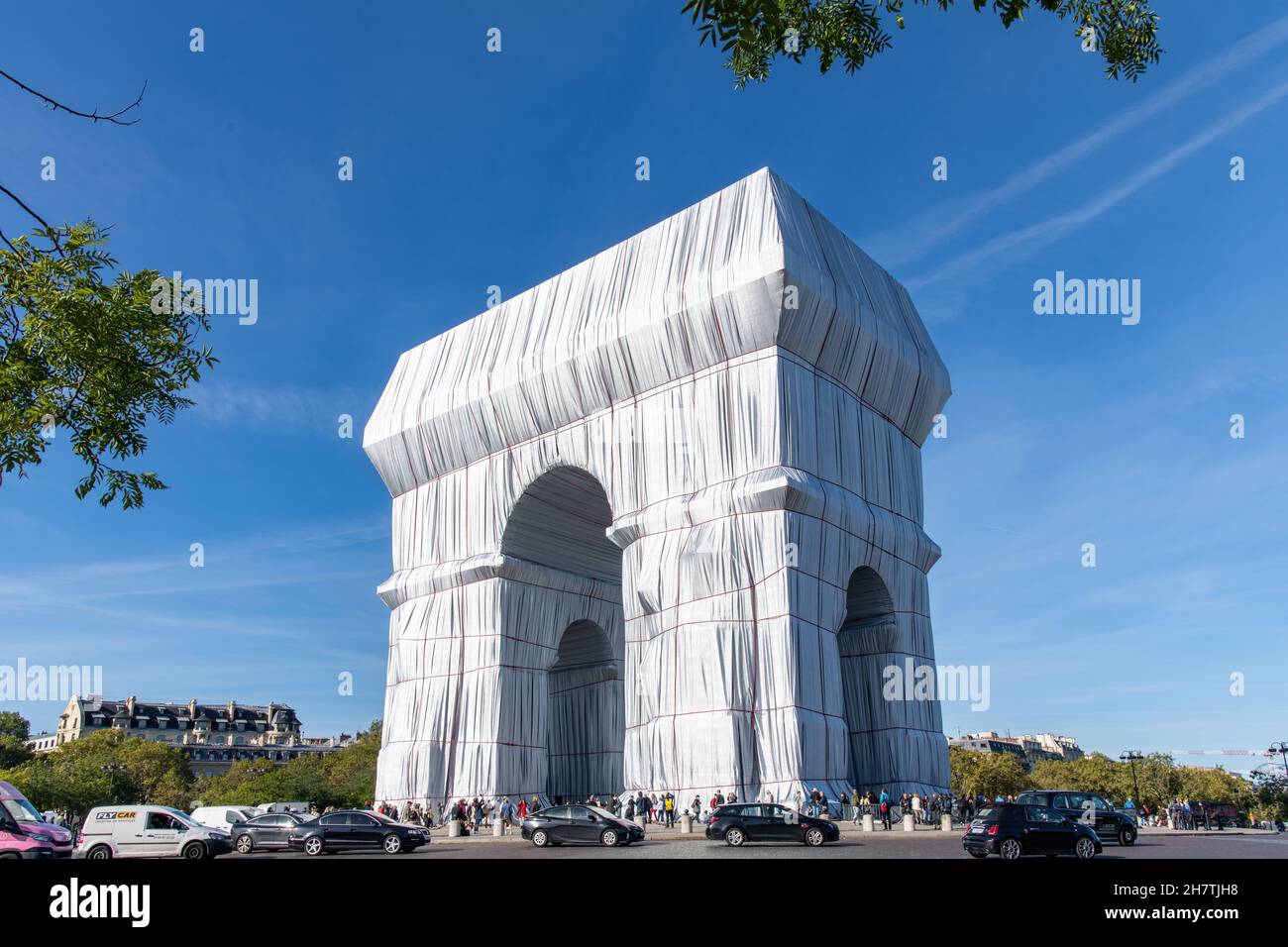 Paris, France-September 2021; Low angle view of wrapped Arc de Triomphe art installation by Christo with Place Charles de Gaulle filled with tourists Stock Photo