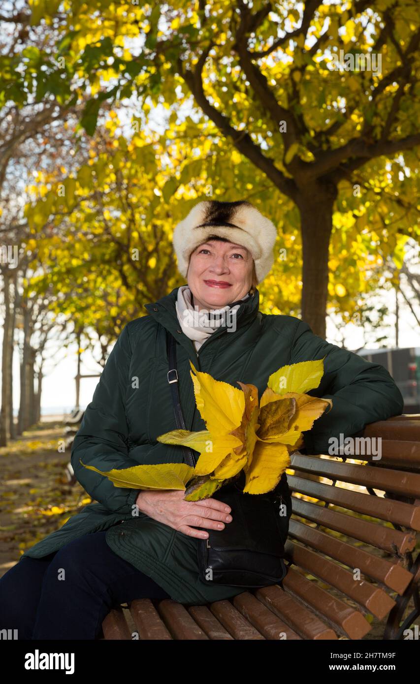 Woman walking on park bench hi-res stock photography and images - Alamy