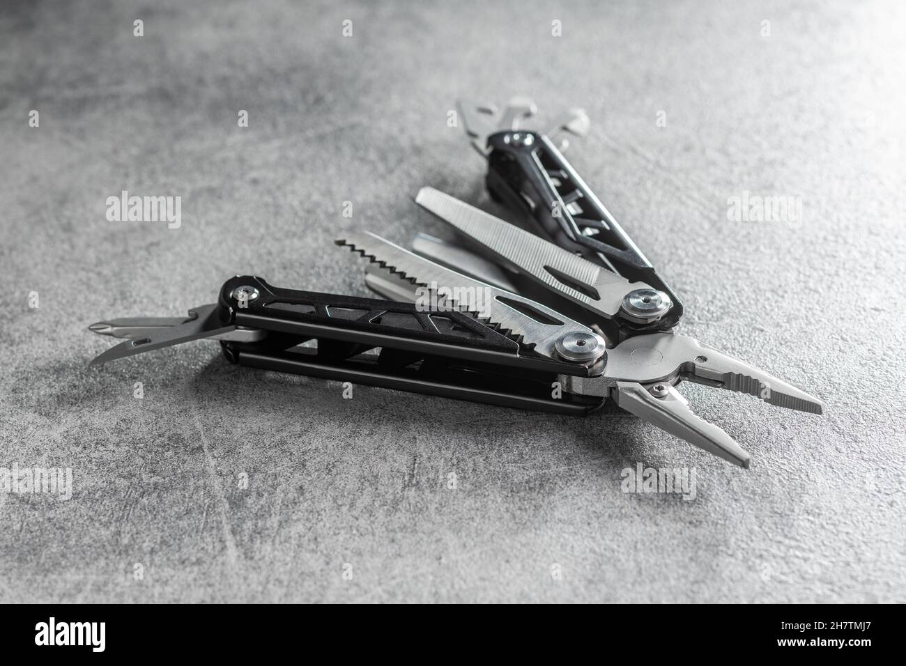 Multitools pliers with other tools and knife. Multifunction pliers