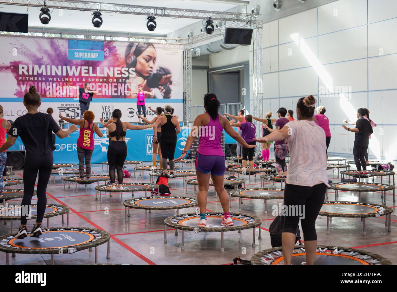 Mini Rebounder Workout People doing Fitness Exercise in Class at Gym
