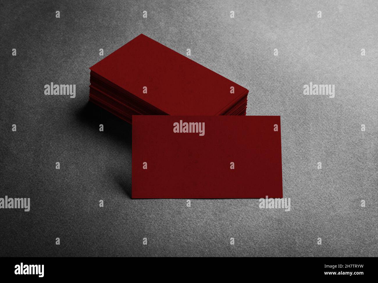 Blank dark red business card on grey background top view. Stock Photo