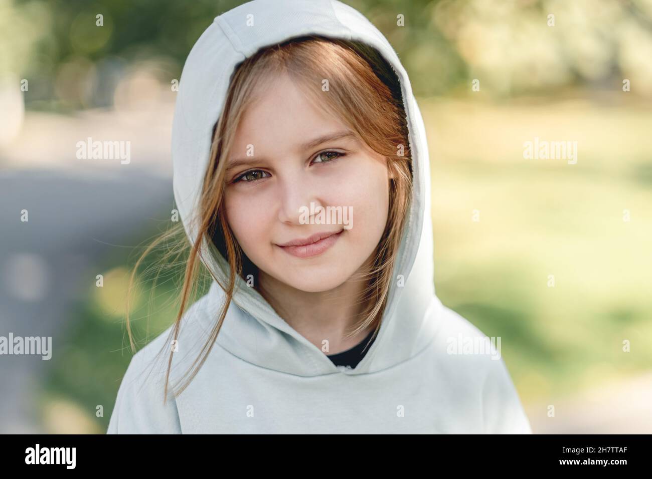 Portrait of happy little girl in hoodie Stock Photo Alamy