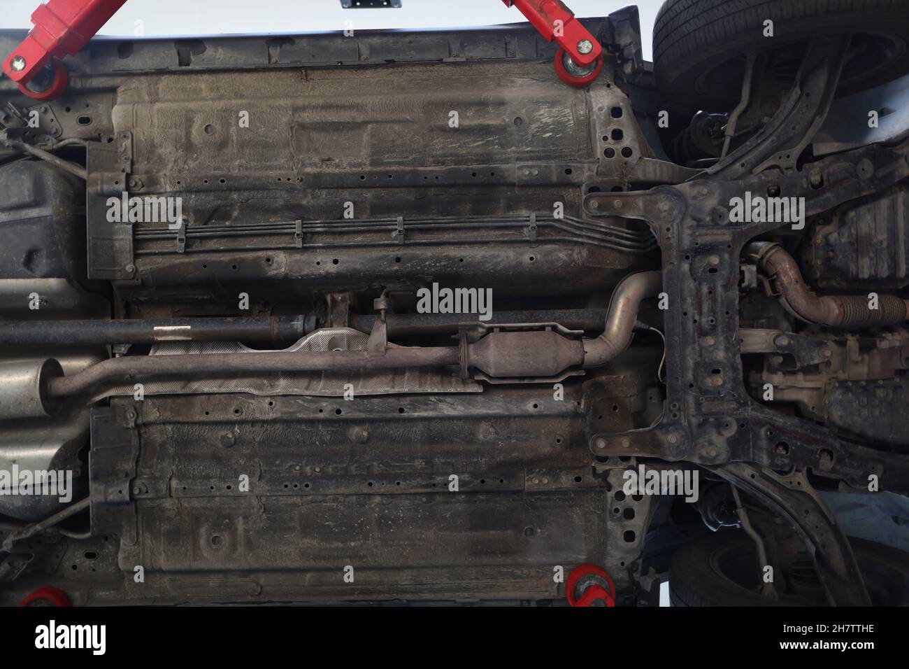 Car lifted in maintenance service to check availability undercarriage