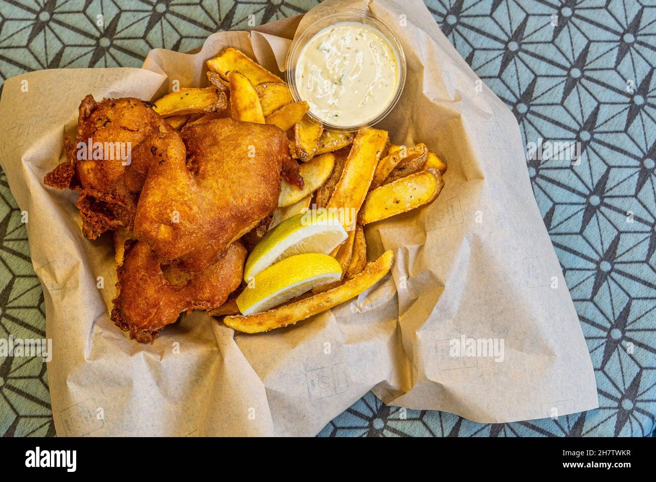 Atlantic cod fillets, breaded and fried, with chips, sauce made of