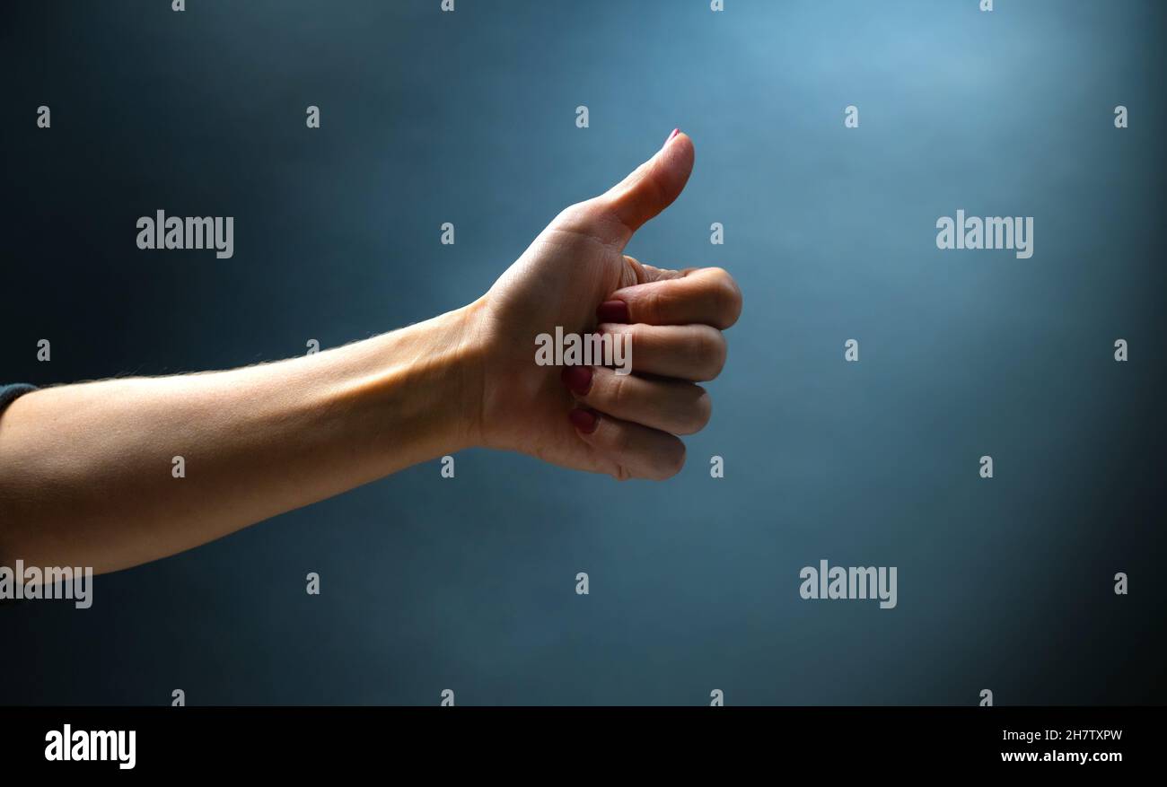 Hand shows signs with fingers Stock Photo