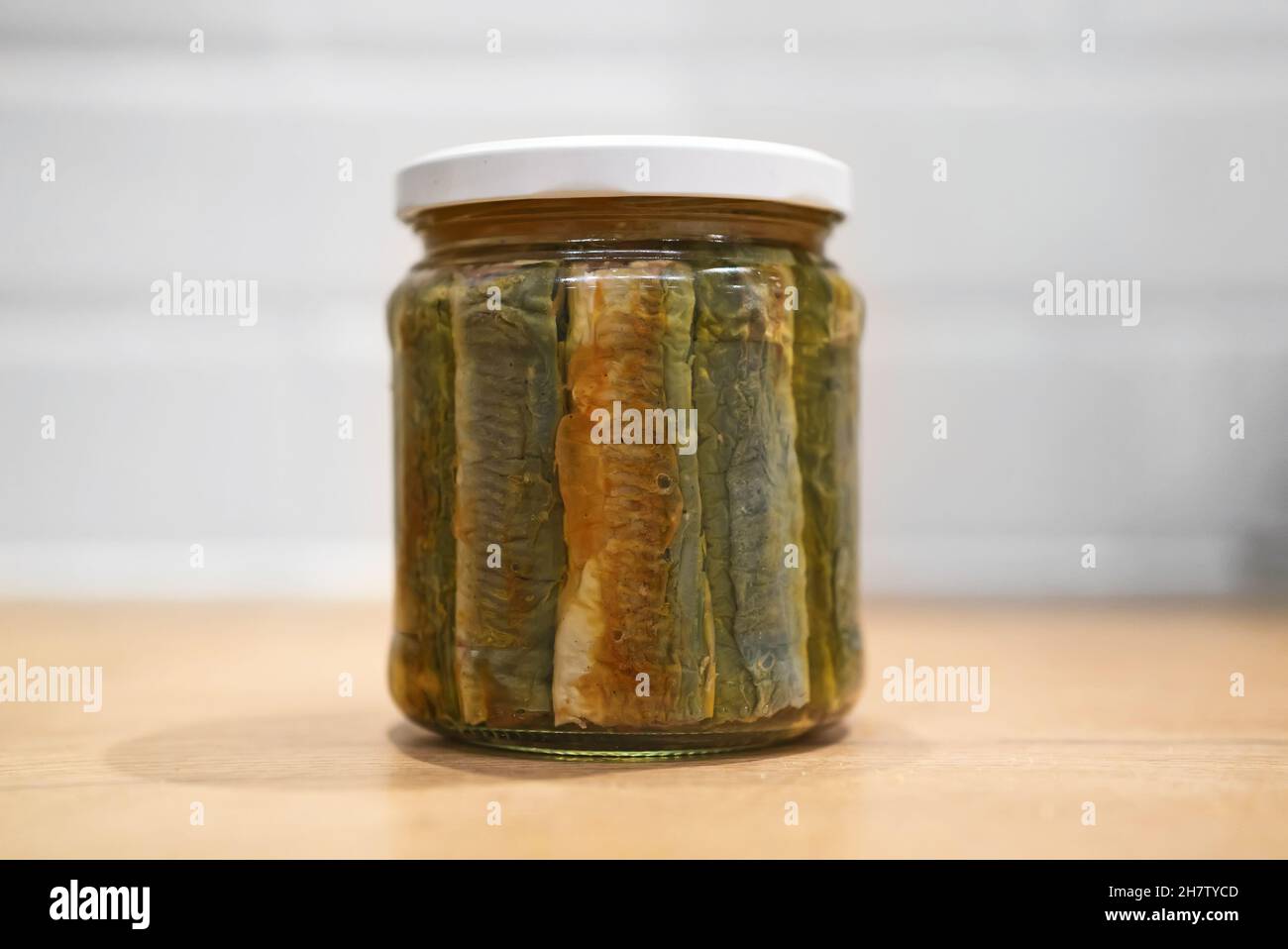 Homemade canned fried lamprey fish with marinade. Stock Photo