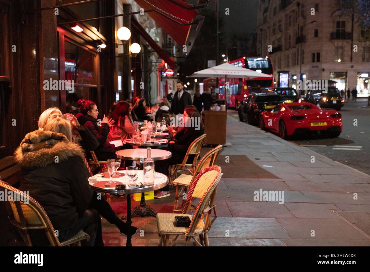 Diners sat outside of 'Colbert' Parisian style cafe, Sloane Square, London, England, United Kingdom Stock Photo