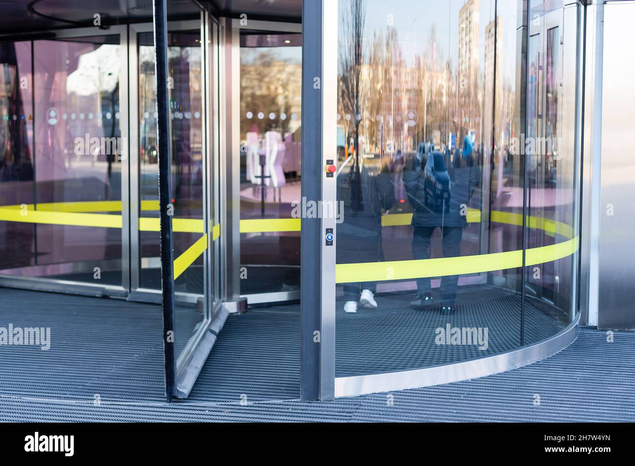 Revolving glass door on modern corporate building Stock Photo