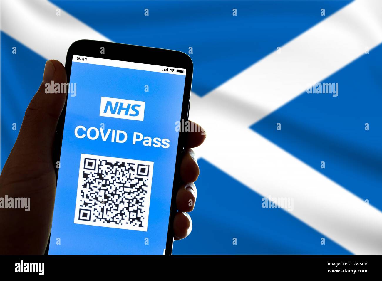 Spain. 24th Nov, 2021. In this illustrative photo a symbolic NHS covid certificate, also called vaccination passport, is seen on the screen of a mobile phone with the Scottish flag in the background in Barcelona, Spain on November 24, 2021. The implementation of the covid19 passport in the Uk is expected to begin on November 29, the covid pass will be needed to access hospitality and event venues. (Photo by Davide Bonaldo/Sipa USA) Credit: Sipa USA/Alamy Live News Stock Photo