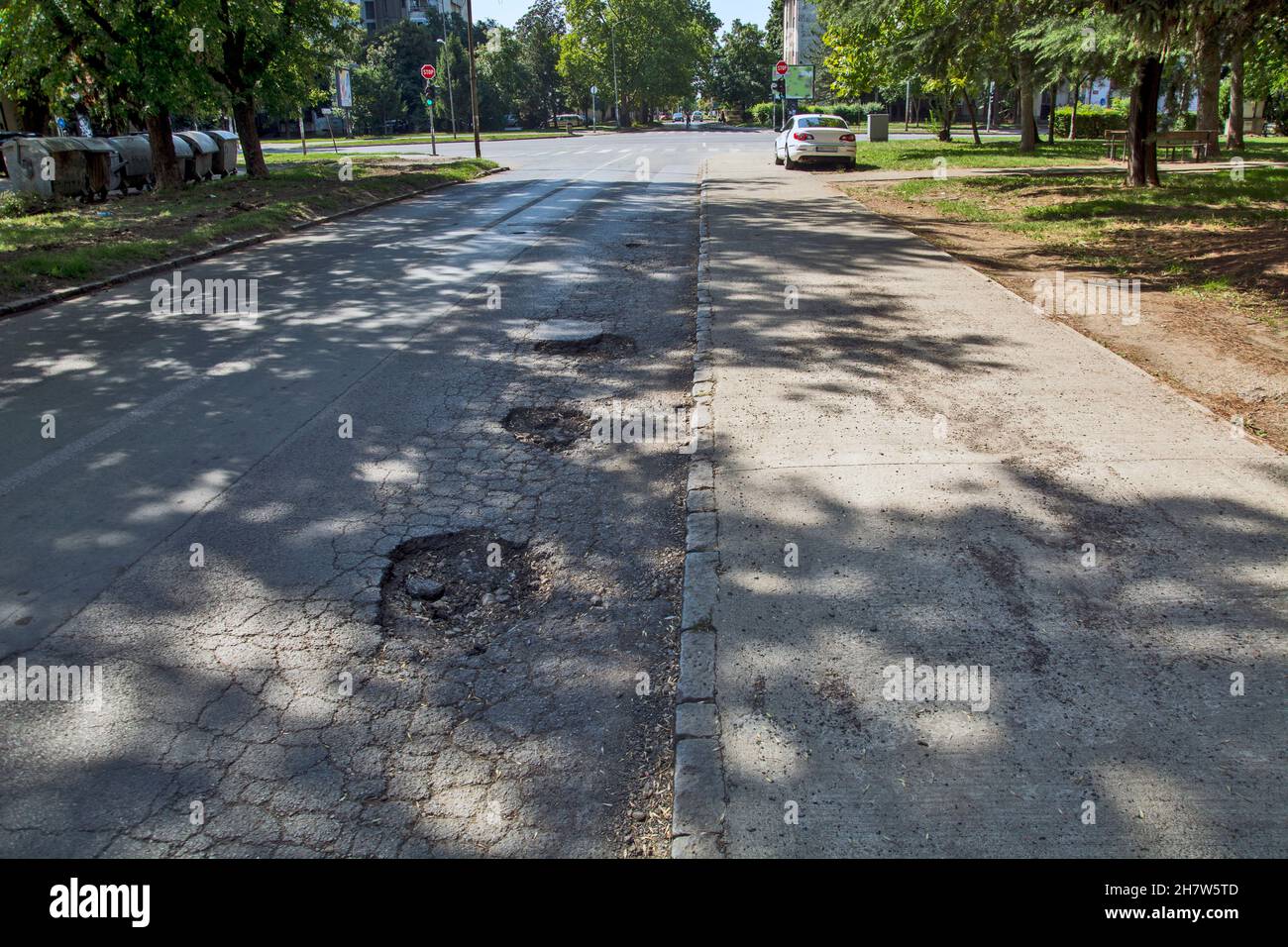 Gouges On Highway Three big holes on the asphalt road that are very dangerous when it ...