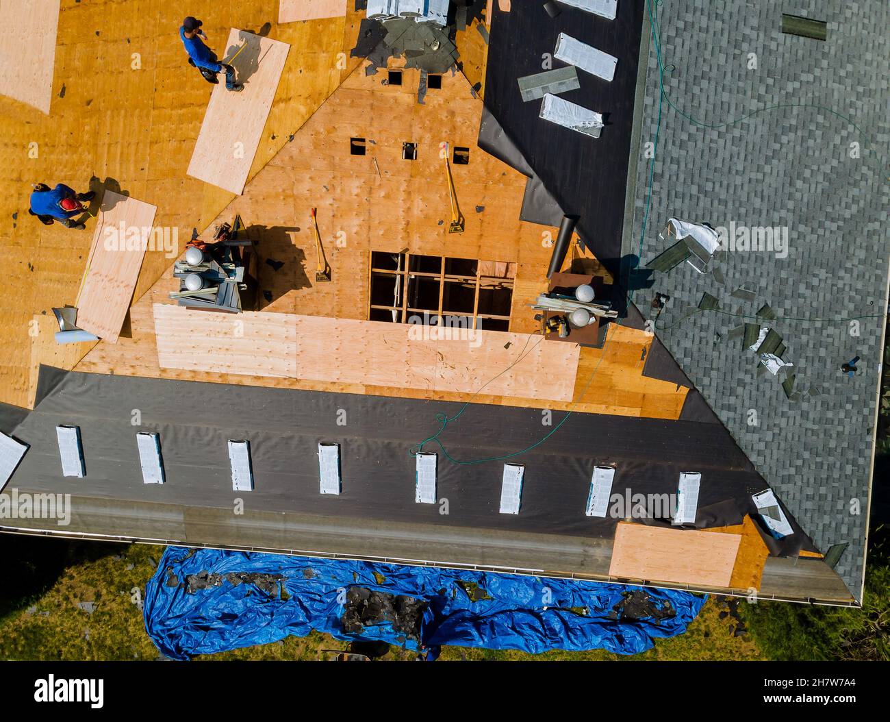 Removal of old roof and replacement roofs with new roof shingle being