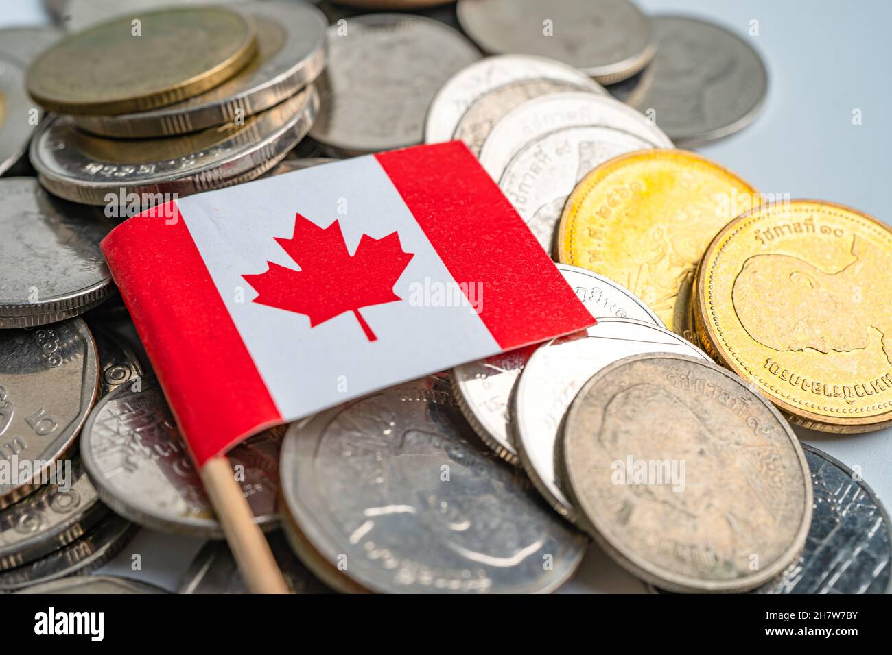 Stack of coins with Canada flag on white background Stock Photo - Alamy