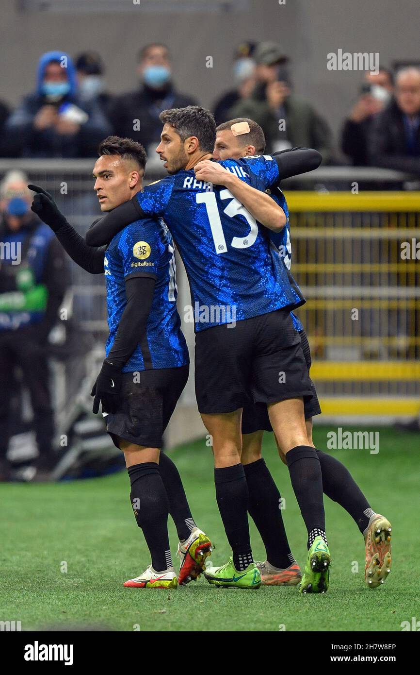 Milano, Italy. 24th Nov, 2021. Edin Dzeko (9), Lautaro Martinez (10) and Andrea Ranocchia (13) of Inter celebrate a goal during the UEFA Champions League match between Inter and Shakhtar Donetsk at Giuseppe Meazza in Milano. (Photo Credit: Gonzales Photo/Alamy Live News Stock Photo