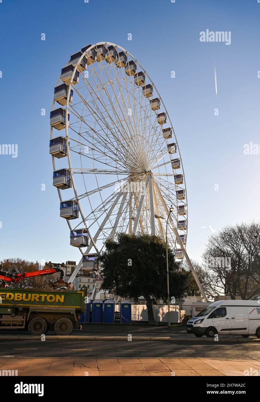 Brighton UK 25th November 2021 - A giant ferris wheel has been erected in the Old Steine Brighton which is to be part of the Brighton Christmas Festival this year : Credit Simon Dack / Alamy Live News Stock Photo