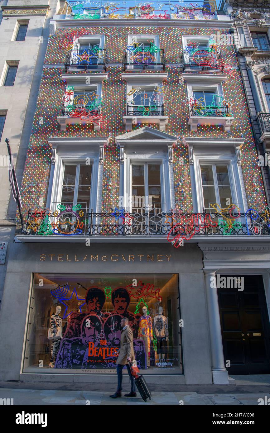 25 November 2021. Christmas Stella McCartney shop front in Old Bond Street, London UK with The Beatles window decor Stock Photo