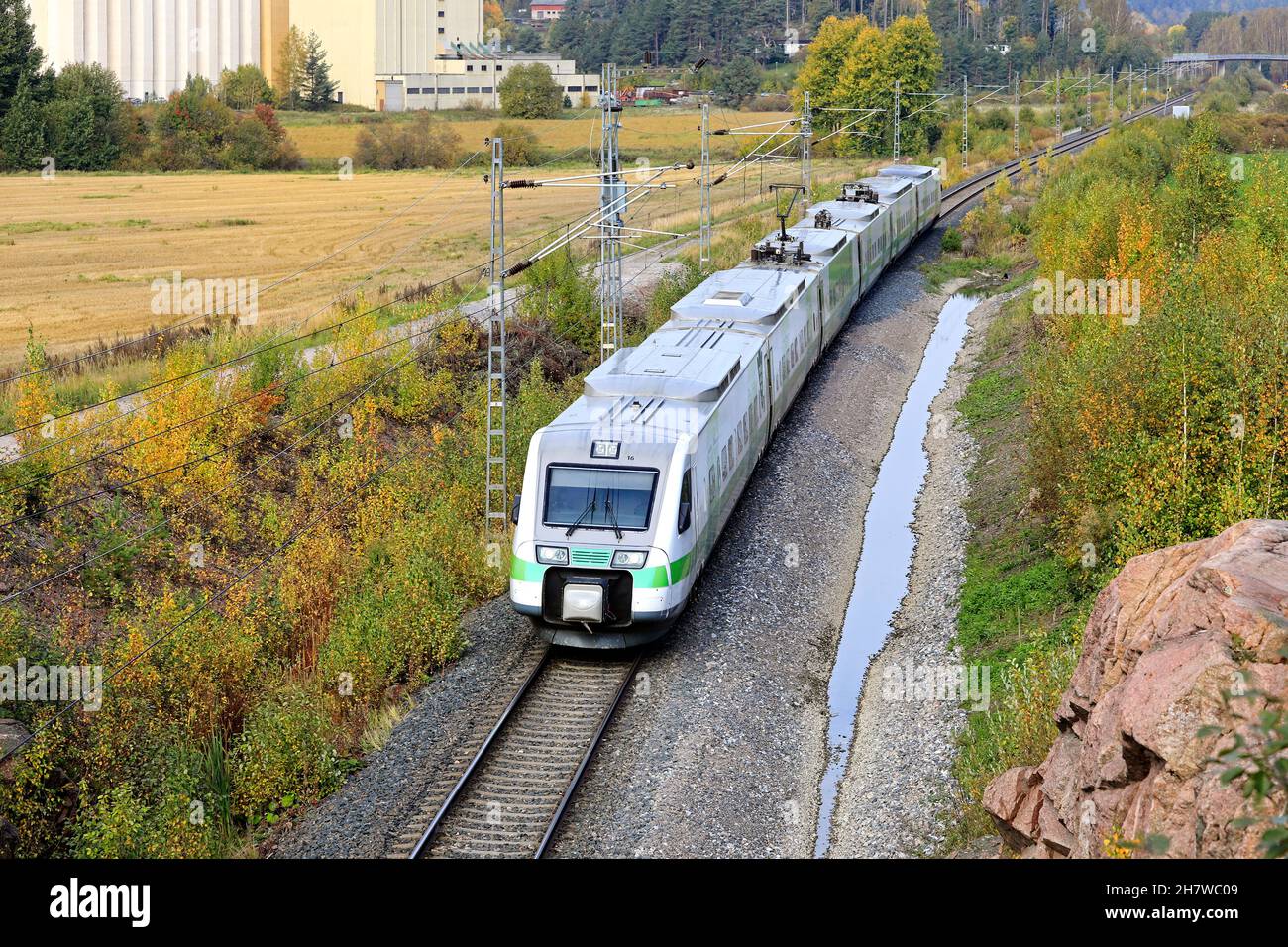 Pendolino Express train of VR group travelling through autumnal scenery in Finland, elevated view. Salo, Finland. September 26, 2020. Stock Photo