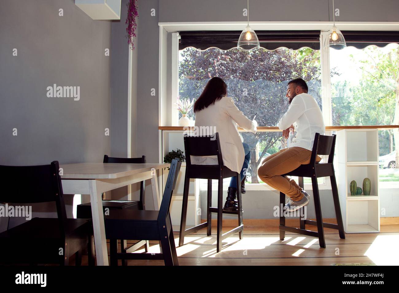 Meeting in a coffee shop. Job interview. Couple talking in coffee shop